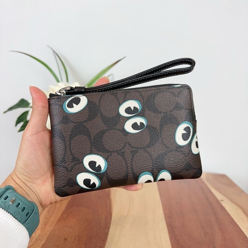 Coach Black and White Wristlet with Eye Design